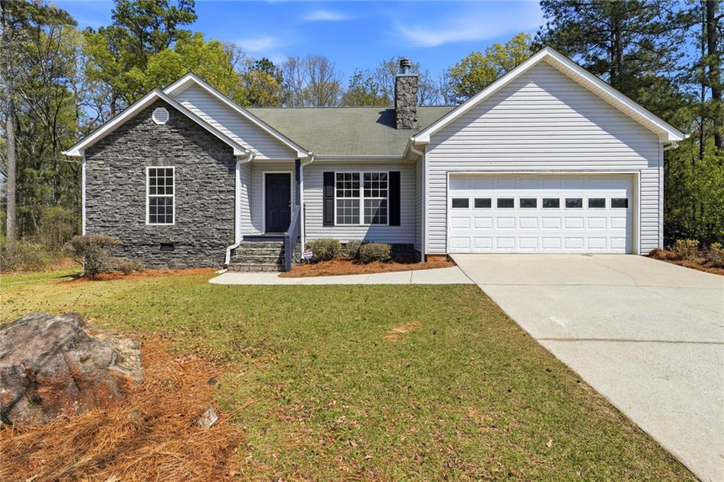 110 Hardwood Road Lexington, GA 30648 - Photo 1 of 1 a view of a house with table and chairs in patio