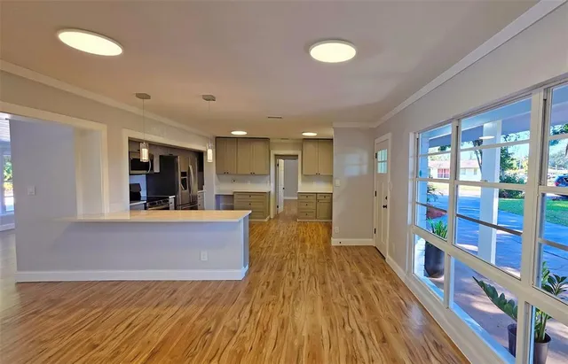 a view of living room with furniture and wooden floor