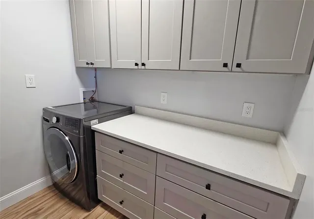 a view of cabinets and wooden floor