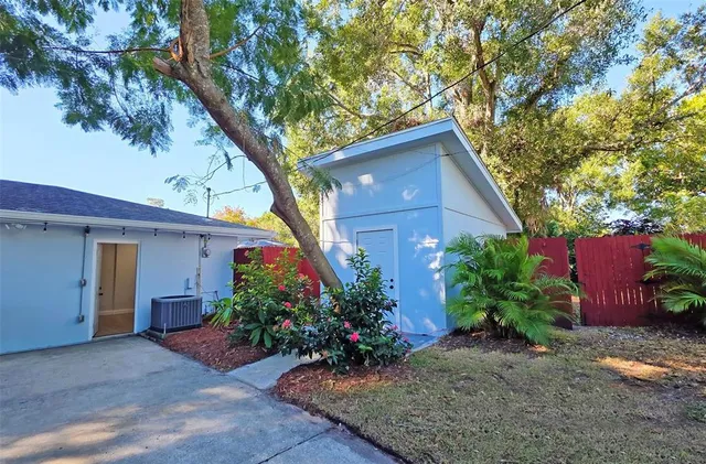 a flower plants in front of a house