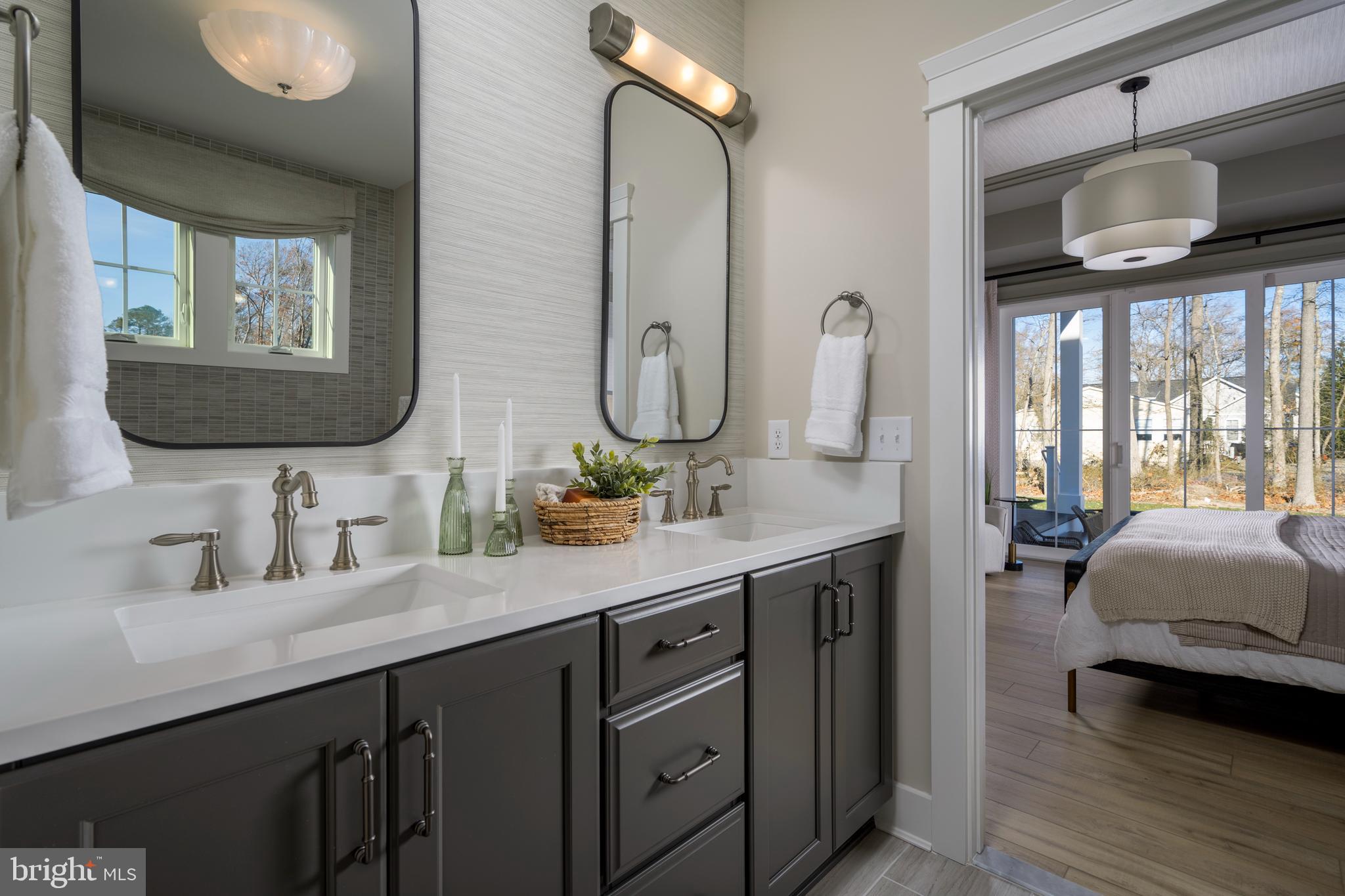 32354 Solara Way Lewes, DE 19958 - Photo 14 of 20 a bathroom with a double vanity sink and a mirror