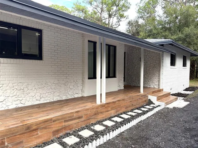 a backyard of a house with seating space