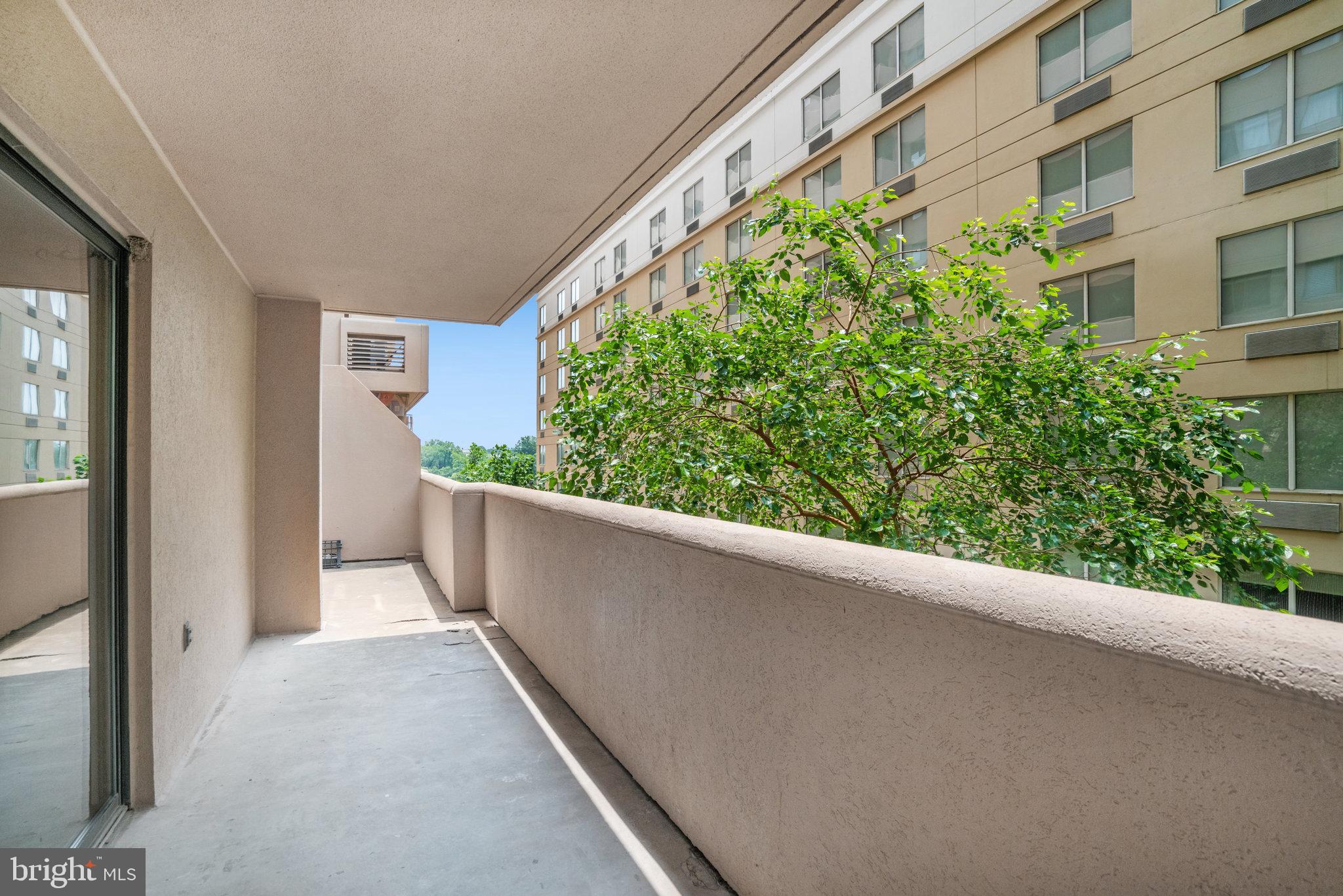 1301 North Courthouse Road, Unit 611 Arlington, VA 22201 - Photo 13 of 32 a view of a balcony with an outdoor space