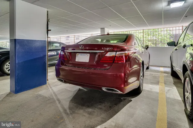 a bed sitting in a room next to a window