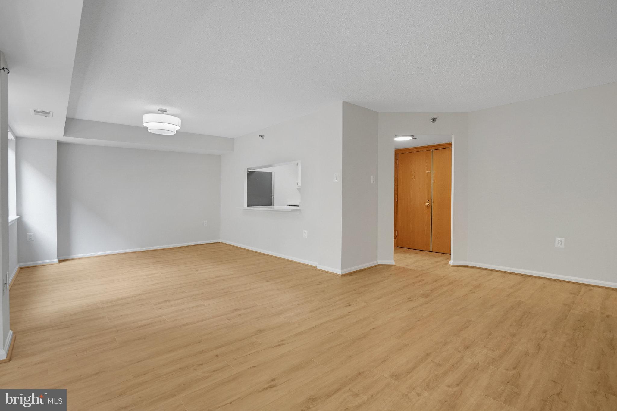 1301 North Courthouse Road, Unit 611 Arlington, VA 22201 - Photo 3 of 32 a view of an empty room and window