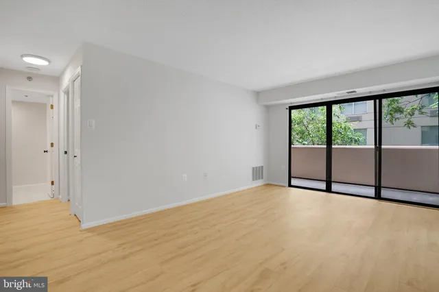a view of an empty room and window