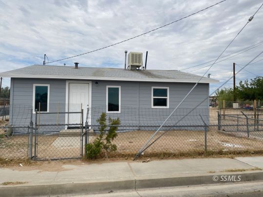 461 South Norma Street Ridgecrest, CA 93555 - Photo 3 of 17 a front view of a house with garage