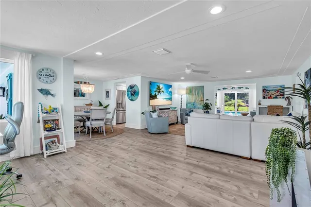 a view of a livingroom with furniture and a window