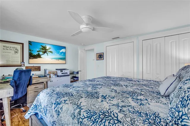 a living room with furniture and a view of kitchen
