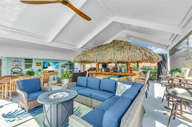 an aerial view of a city with lots of residential buildings and ocean view in back