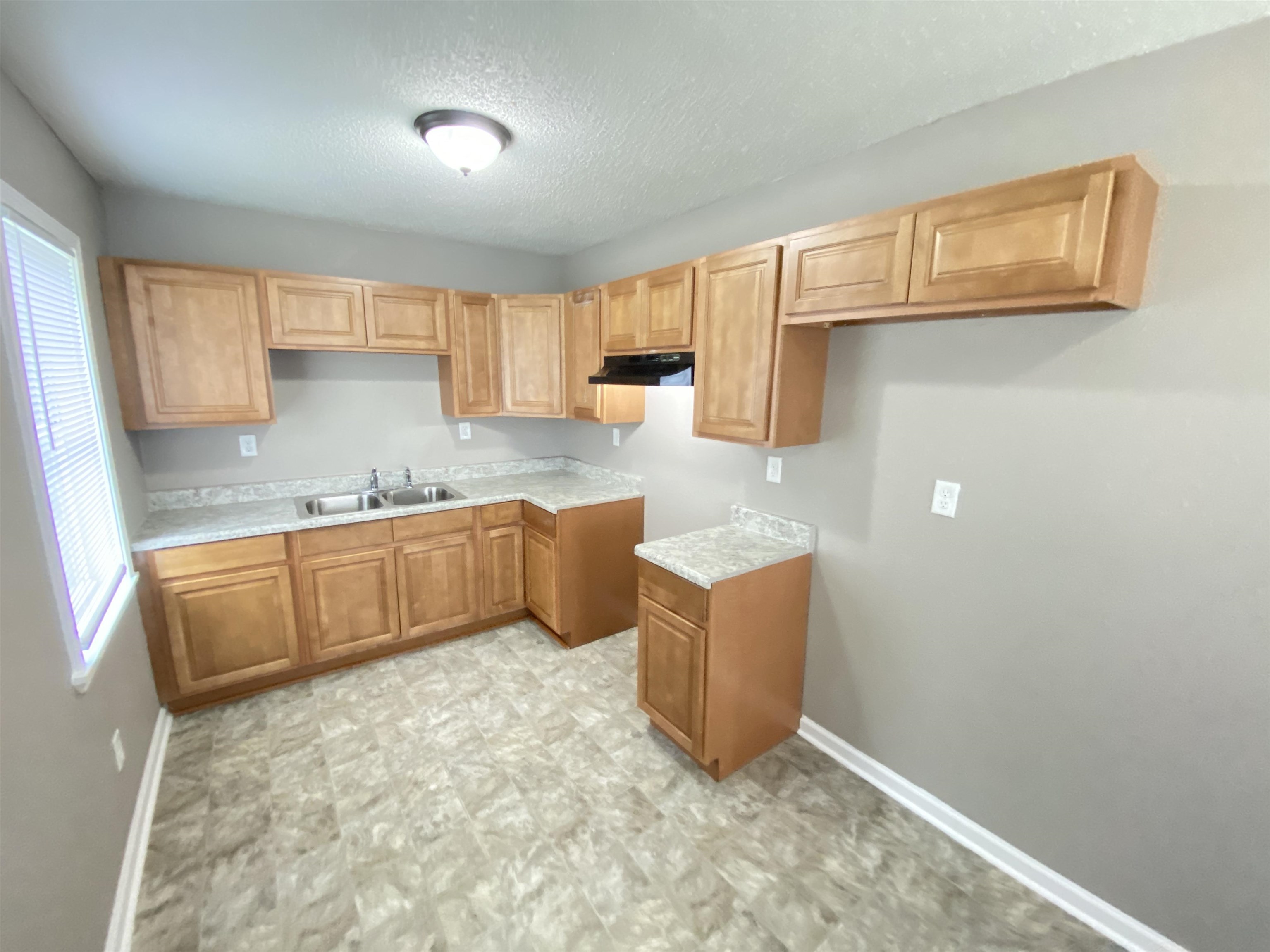 2581 Callie Road Memphis, TN 38127 - Photo 11 of 13 a kitchen with granite countertop a sink a stove and cabinets