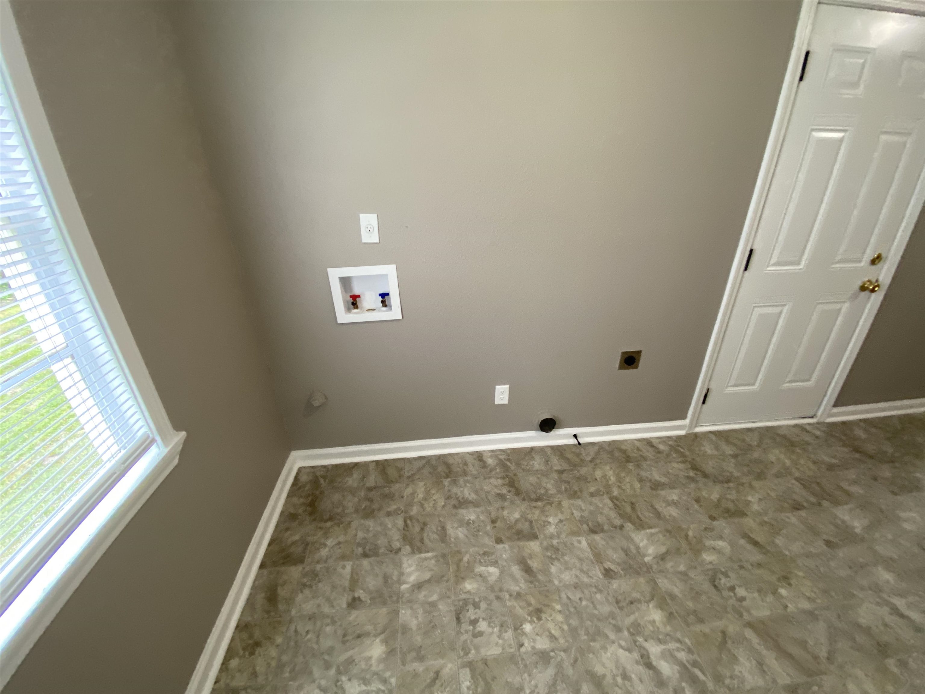 2581 Callie Road Memphis, TN 38127 - Photo 3 of 13 a view of an empty room and window