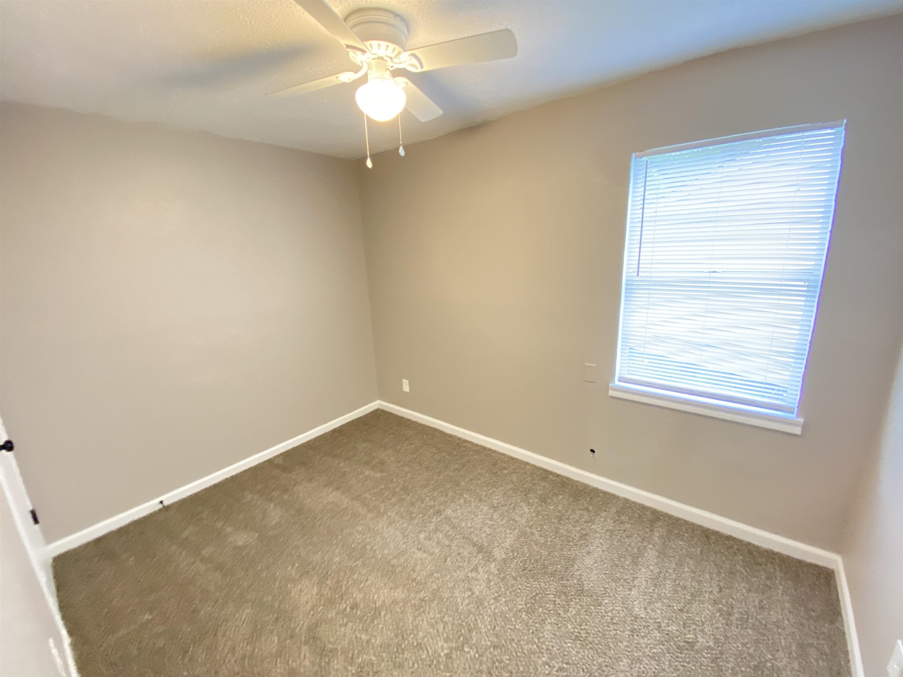 2581 Callie Road Memphis, TN 38127 - Photo 4 of 13 an empty room with a window