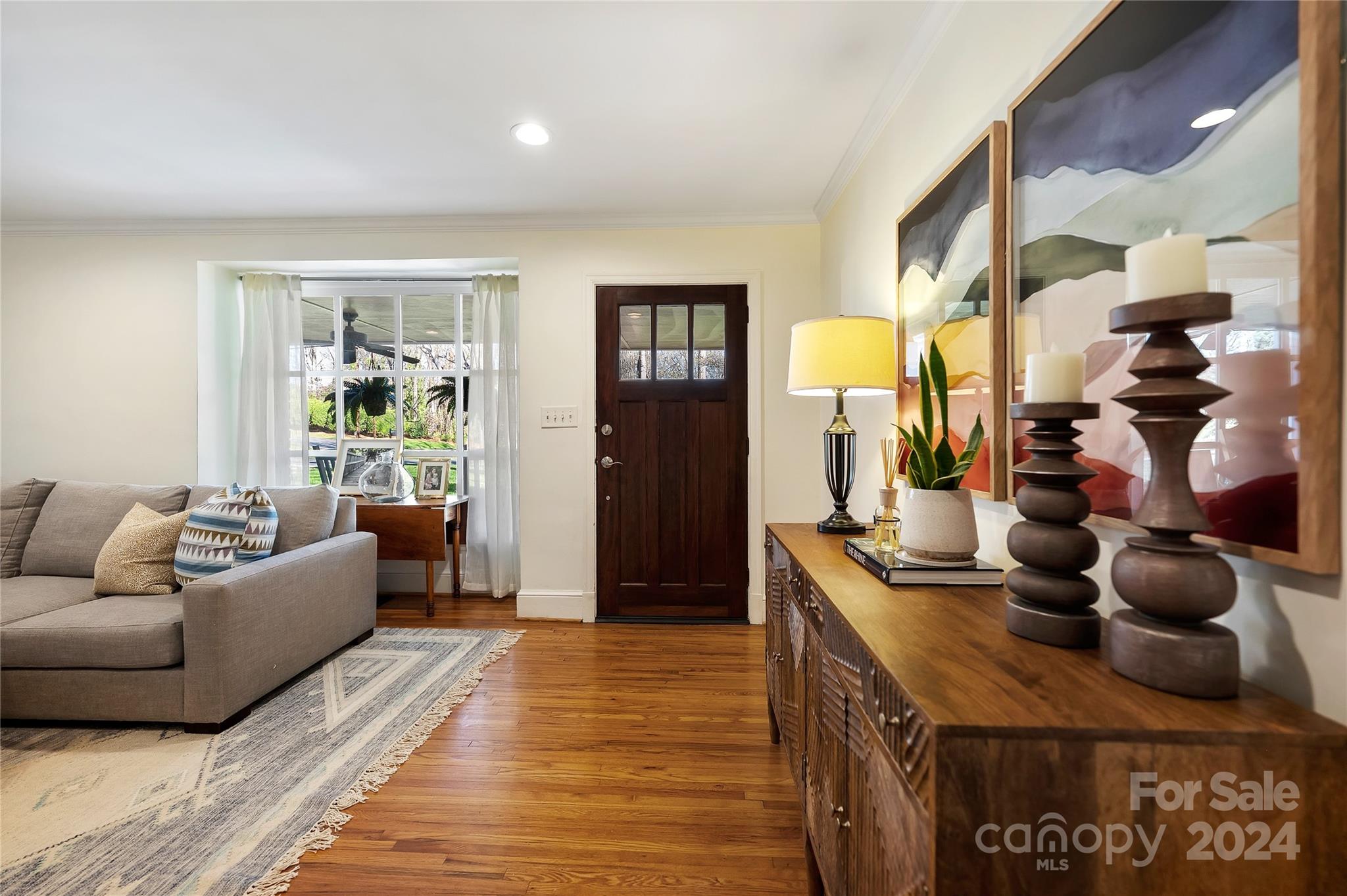 791 Sedgefield Road Charlotte, NC 28209 - Photo 5 of 33 a living room with furniture and a lamp