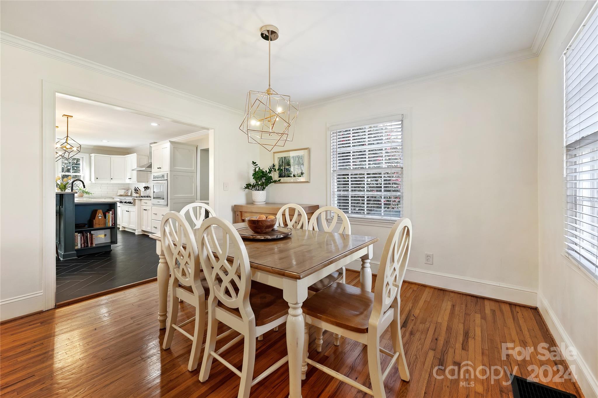 791 Sedgefield Road Charlotte, NC 28209 - Photo 8 of 33 a view of a dining room with furniture window and wooden floor