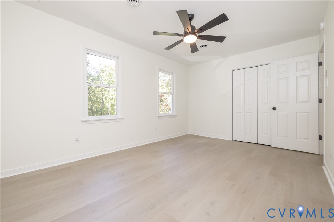 2311 Moseley Road Moseley, VA 23120 - Photo 34 of 50 an empty room with windows and fan