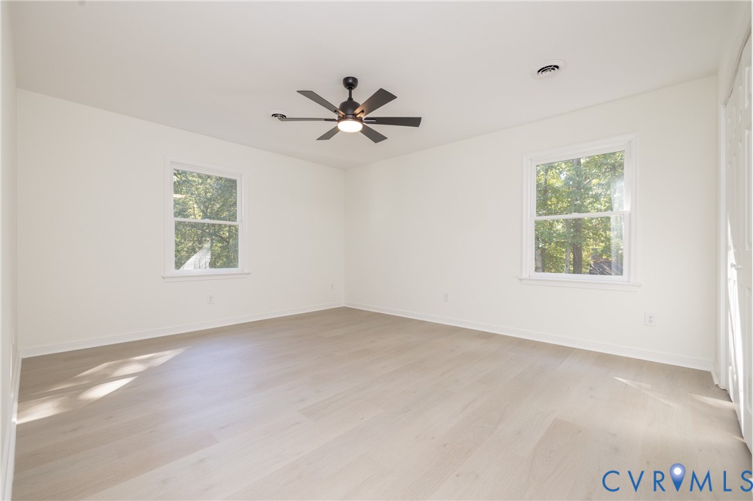 2311 Moseley Road Moseley, VA 23120 - Photo 35 of 50 an empty room with windows and fan