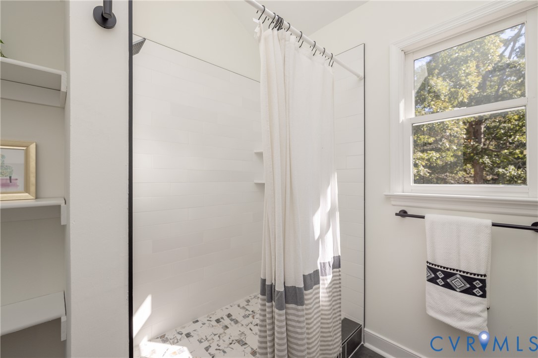 2311 Moseley Road Moseley, VA 23120 - Photo 44 of 50 a bathroom with a shower and a window