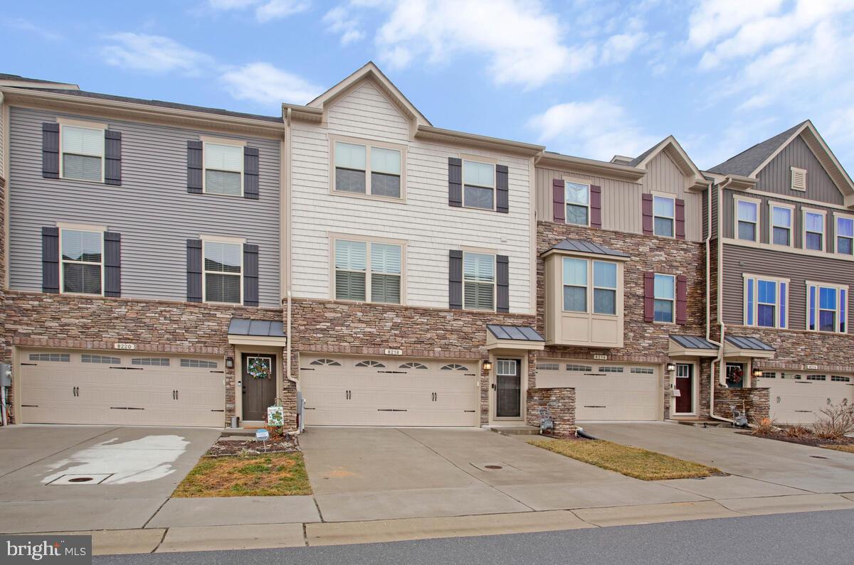 a front view of a house with yard