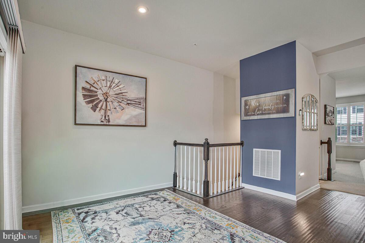 8218 Kippis Road Millersville, MD 21108 - Photo 11 of 40 a view of a hallway with workspace
