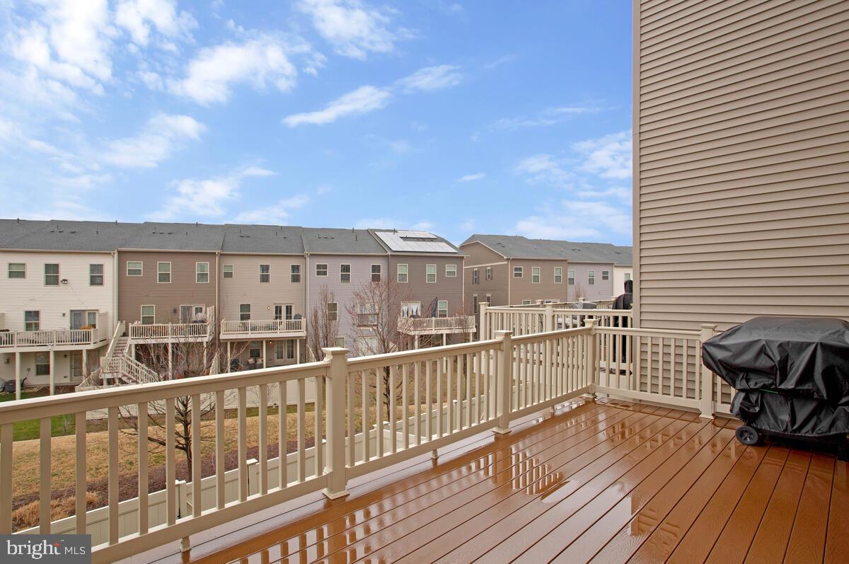 8218 Kippis Road Millersville, MD 21108 - Photo 14 of 40 a view of a balcony with wooden floor and city view