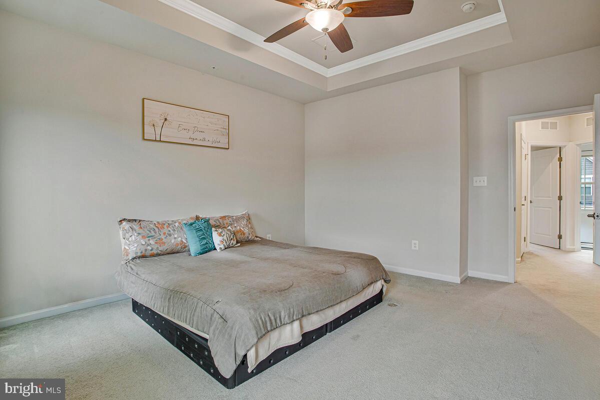 8218 Kippis Road Millersville, MD 21108 - Photo 17 of 40 a bedroom with a bed and ceiling fan