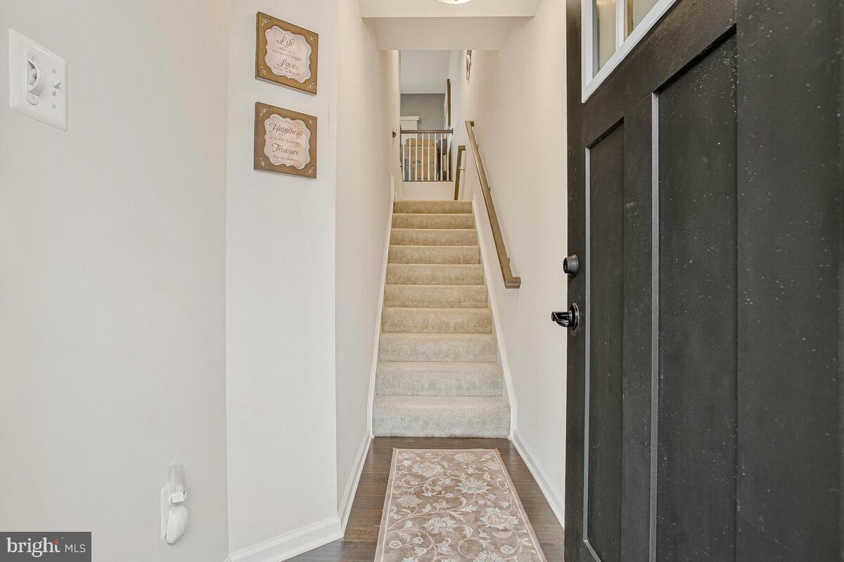8218 Kippis Road Millersville, MD 21108 - Photo 2 of 40 a view of a hallway view with staircase