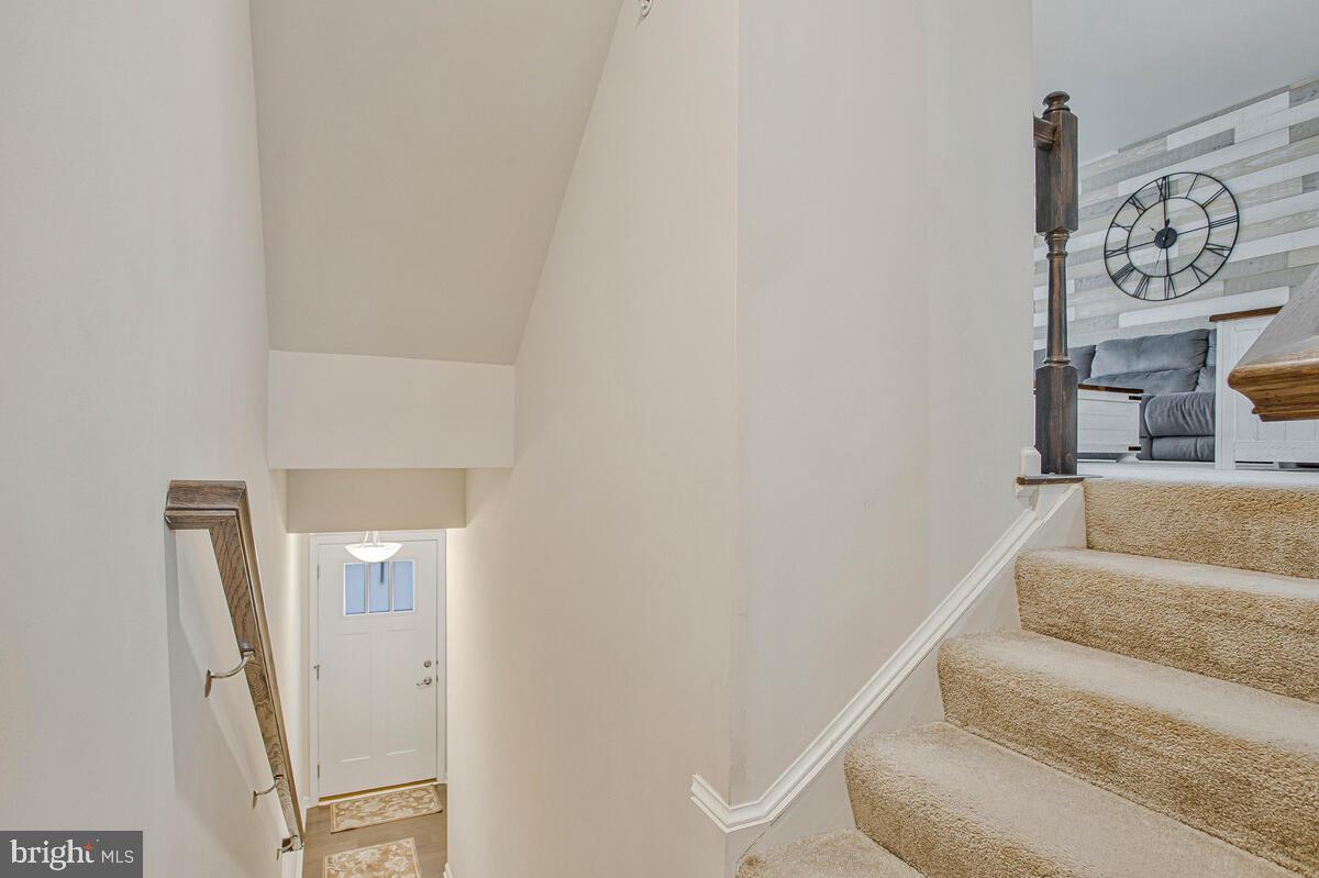8218 Kippis Road Millersville, MD 21108 - Photo 3 of 40 a view of staircase with white walls