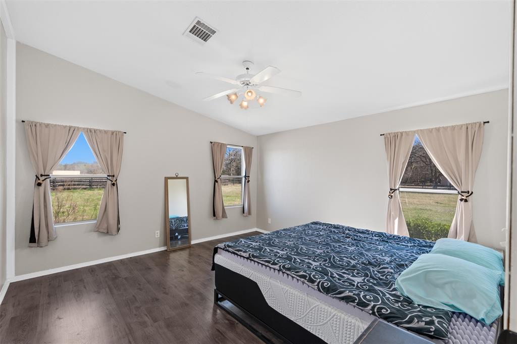 181 Pr 125 Whitney, TX 76692 - Photo 14 of 34 a bedroom with a bed and a dresser next to a window
