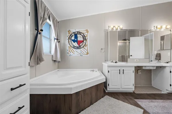 a bathroom with a sink a vanity and a mirror