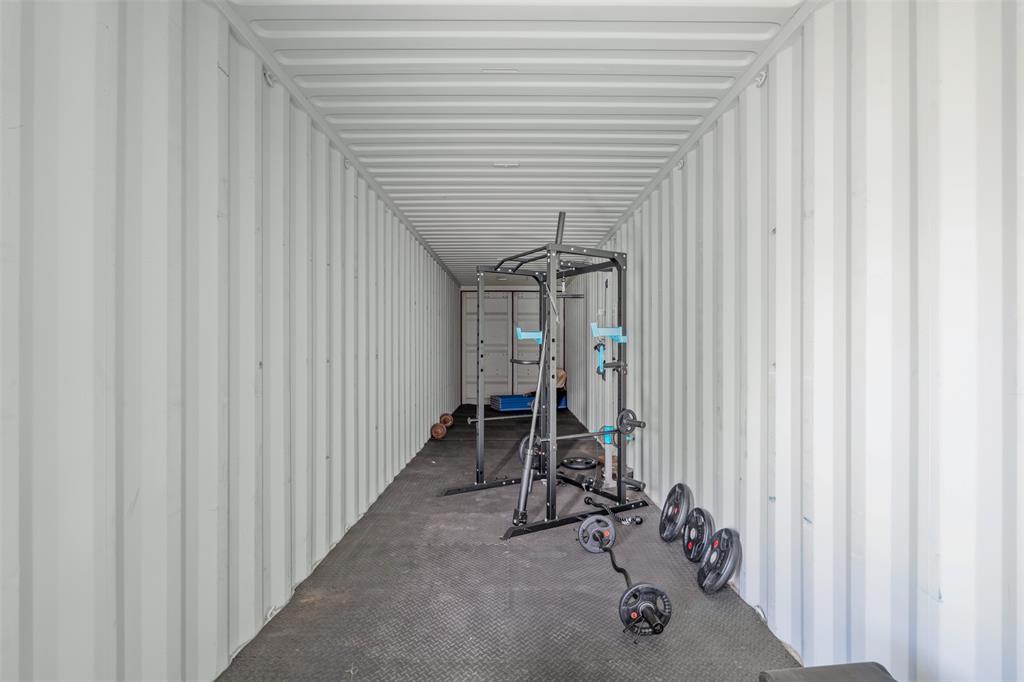 181 Pr 125 Whitney, TX 76692 - Photo 33 of 34 a view of a hallway with wooden walls and stairs