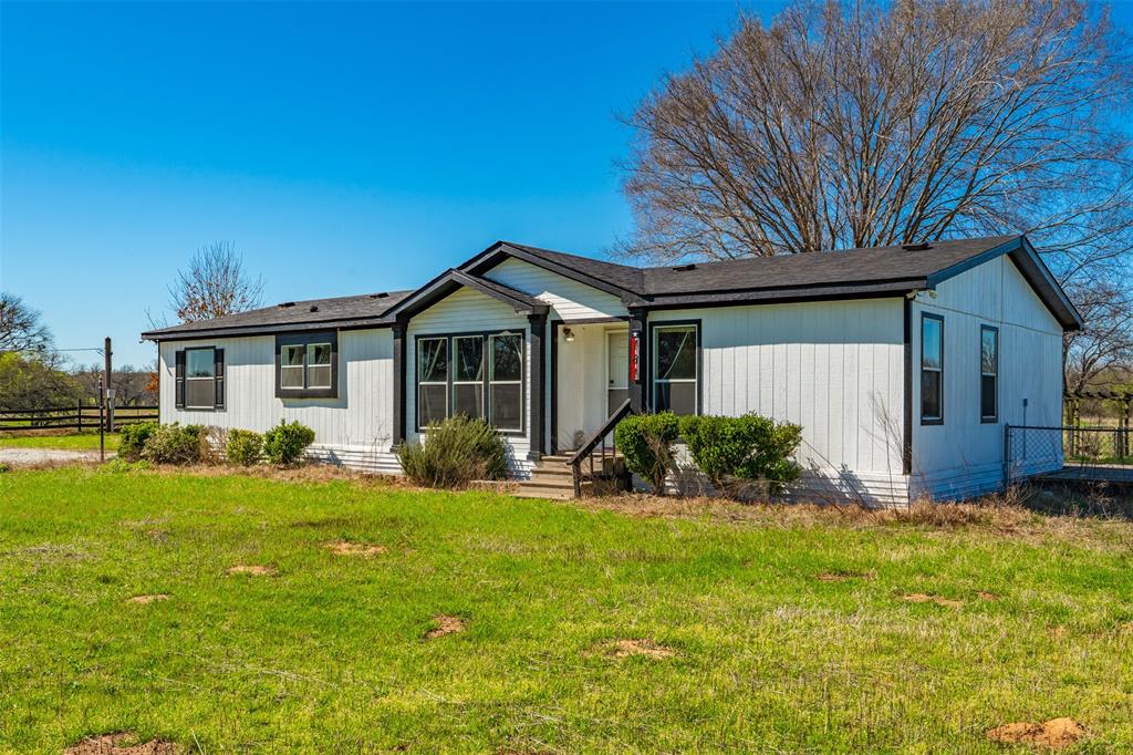 181 Pr 125 Whitney, TX 76692 - Photo 4 of 34 a front view of a house with yard and green space