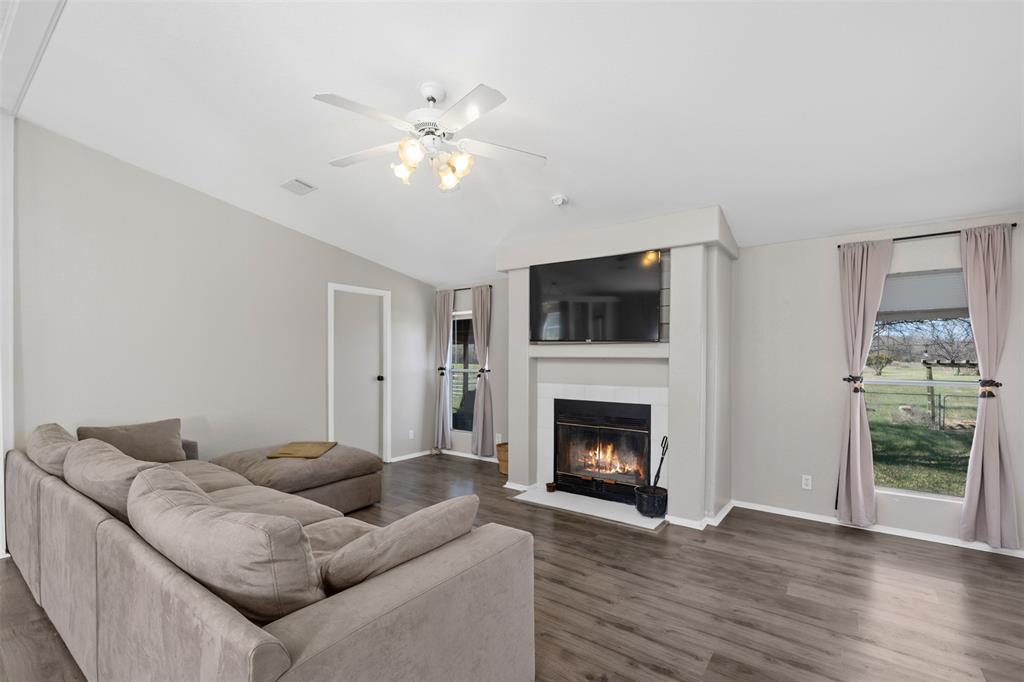 181 Pr 125 Whitney, TX 76692 - Photo 7 of 34 a living room with furniture and a fireplace