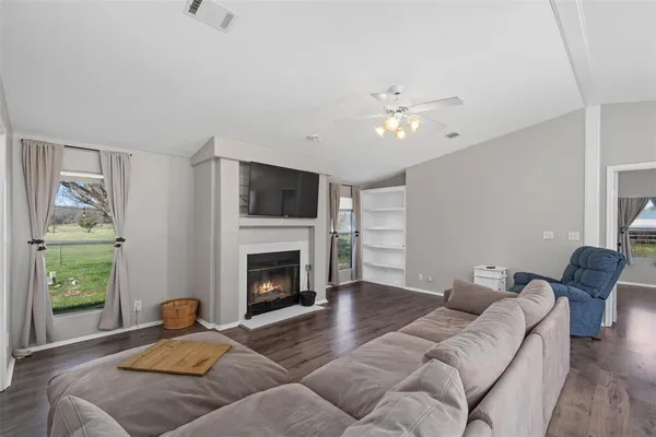 a living room with furniture and a fireplace