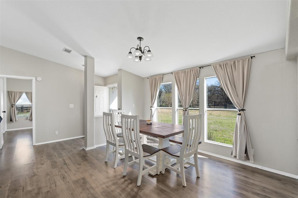 181 Pr 125 Whitney, TX 76692 - Photo 9 of 34 a view of a dining room with furniture window and wooden floor