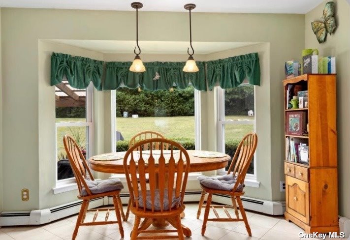 41 Timber Ridge Drive Commack, NY 11725 - Photo 1 of 1 a view of a dining room with furniture window and outside view