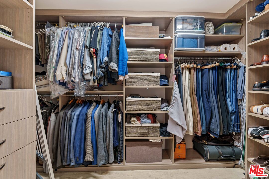 13650 Marina Pointe Drive, Unit 309 Marina del Rey, CA 90292 - Photo 15 of 56 a view of walk in closet with clothes and shoes