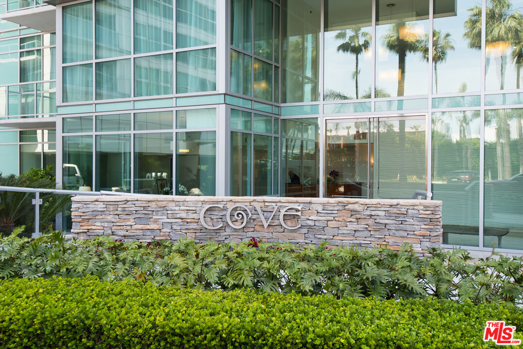 13650 Marina Pointe Drive, Unit 309 Marina del Rey, CA 90292 - Photo 24 of 56 a view of house with a large window and flower plants