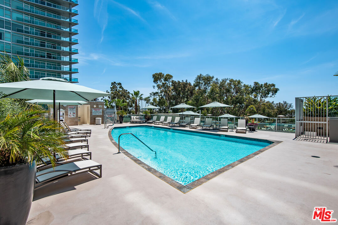 13650 Marina Pointe Drive, Unit 309 Marina del Rey, CA 90292 - Photo 25 of 56 a view of a swimming pool with lounge chair