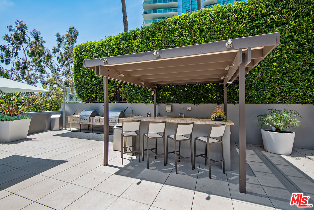 13650 Marina Pointe Drive, Unit 309 Marina del Rey, CA 90292 - Photo 33 of 56 a view of outdoor dining space with a patio