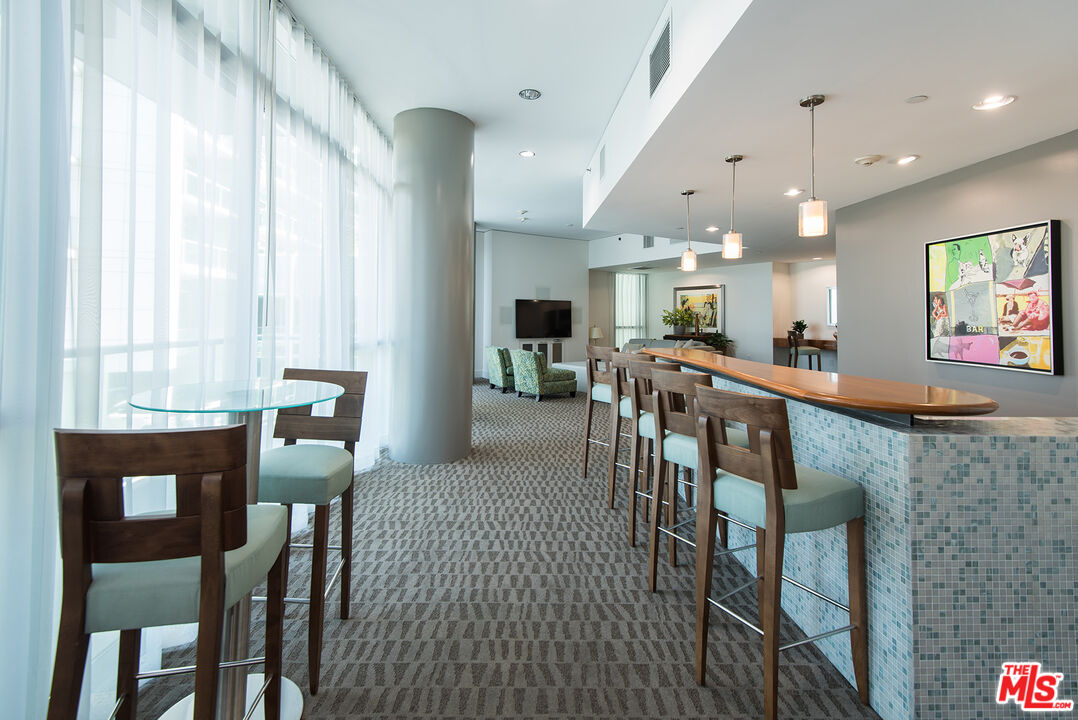 13650 Marina Pointe Drive, Unit 309 Marina del Rey, CA 90292 - Photo 36 of 56 a view of a dining room with furniture window and wooden floor