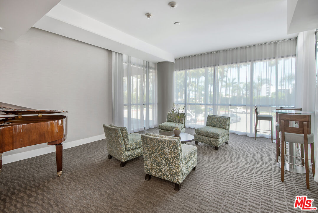 13650 Marina Pointe Drive, Unit 309 Marina del Rey, CA 90292 - Photo 37 of 56 a living room with furniture and a window