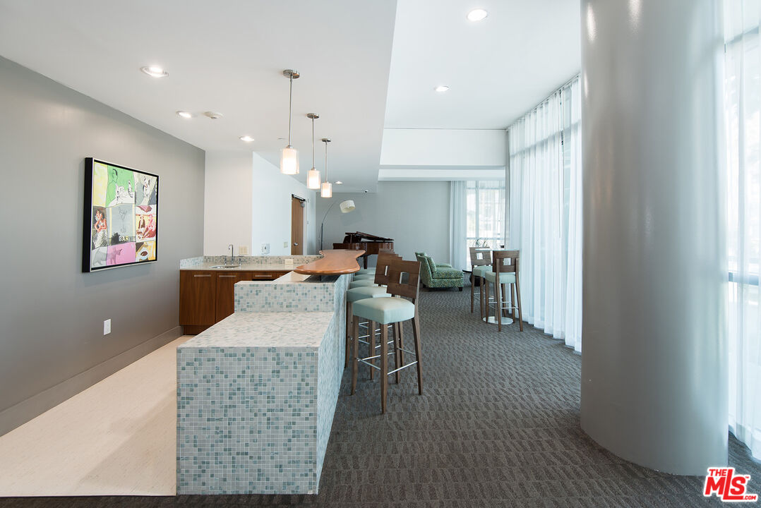 13650 Marina Pointe Drive, Unit 309 Marina del Rey, CA 90292 - Photo 39 of 56 a living room with furniture and a wooden floor
