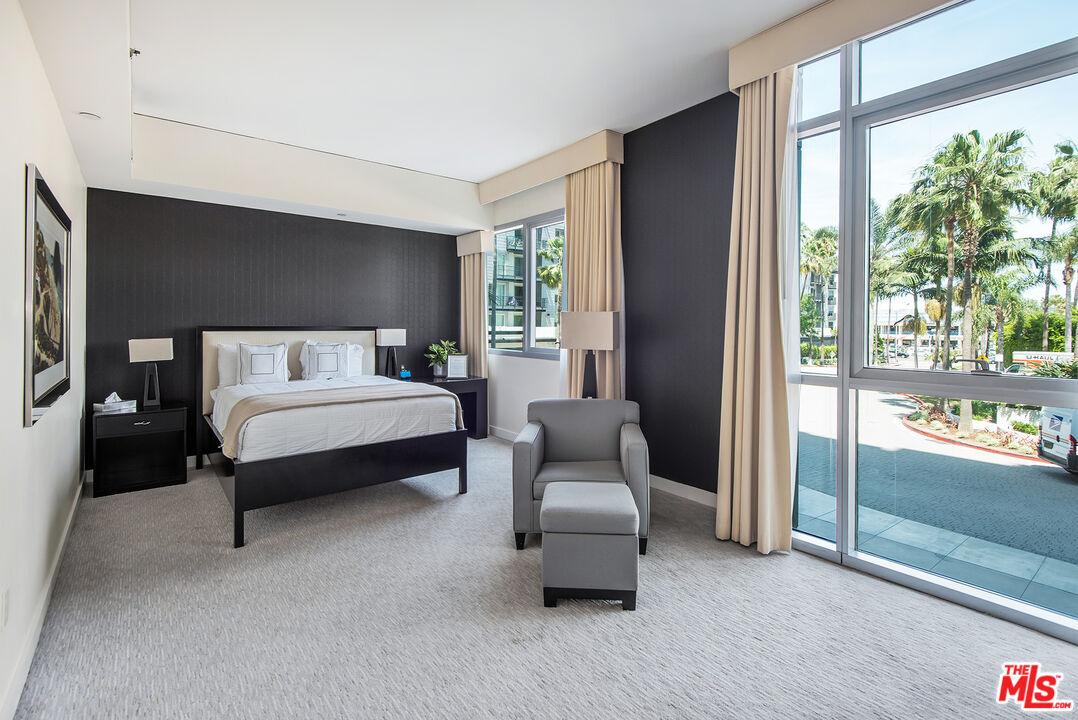 13650 Marina Pointe Drive, Unit 309 Marina del Rey, CA 90292 - Photo 40 of 56 a bedroom with a bed and a walk in closet