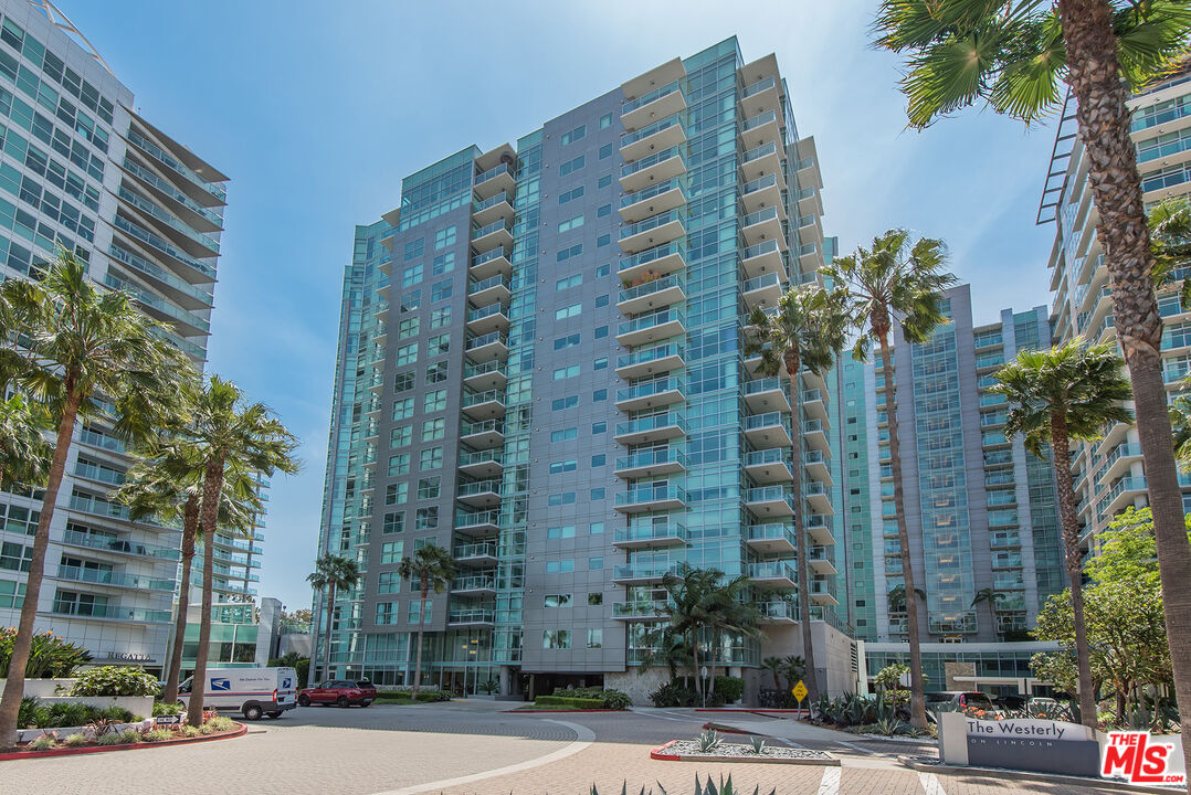 13650 Marina Pointe Drive, Unit 309 Marina del Rey, CA 90292 - Photo 55 of 56 a tall building sitting on the side of a street