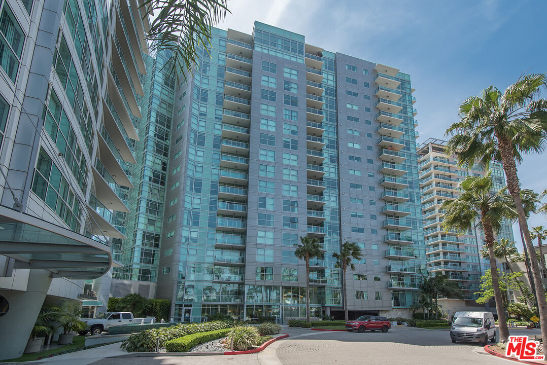 13650 Marina Pointe Drive, Unit 309 Marina del Rey, CA 90292 - Photo 56 of 56 a tall building sitting on the side of a street