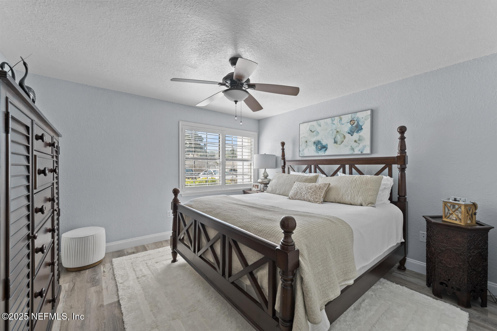 425 Timberwalk Court, Unit 1112 Ponte Vedra Beach, FL 32082 - Photo 18 of 66 a bedroom with a bed and a chandelier