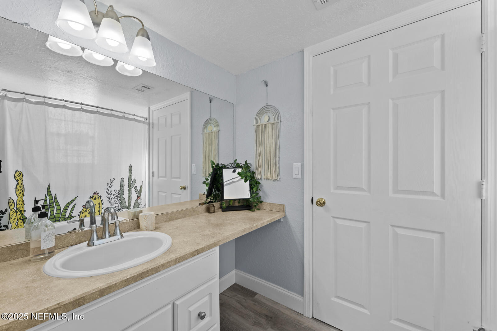 425 Timberwalk Court, Unit 1112 Ponte Vedra Beach, FL 32082 - Photo 25 of 66 a bathroom with a sink vanity granite and a mirror