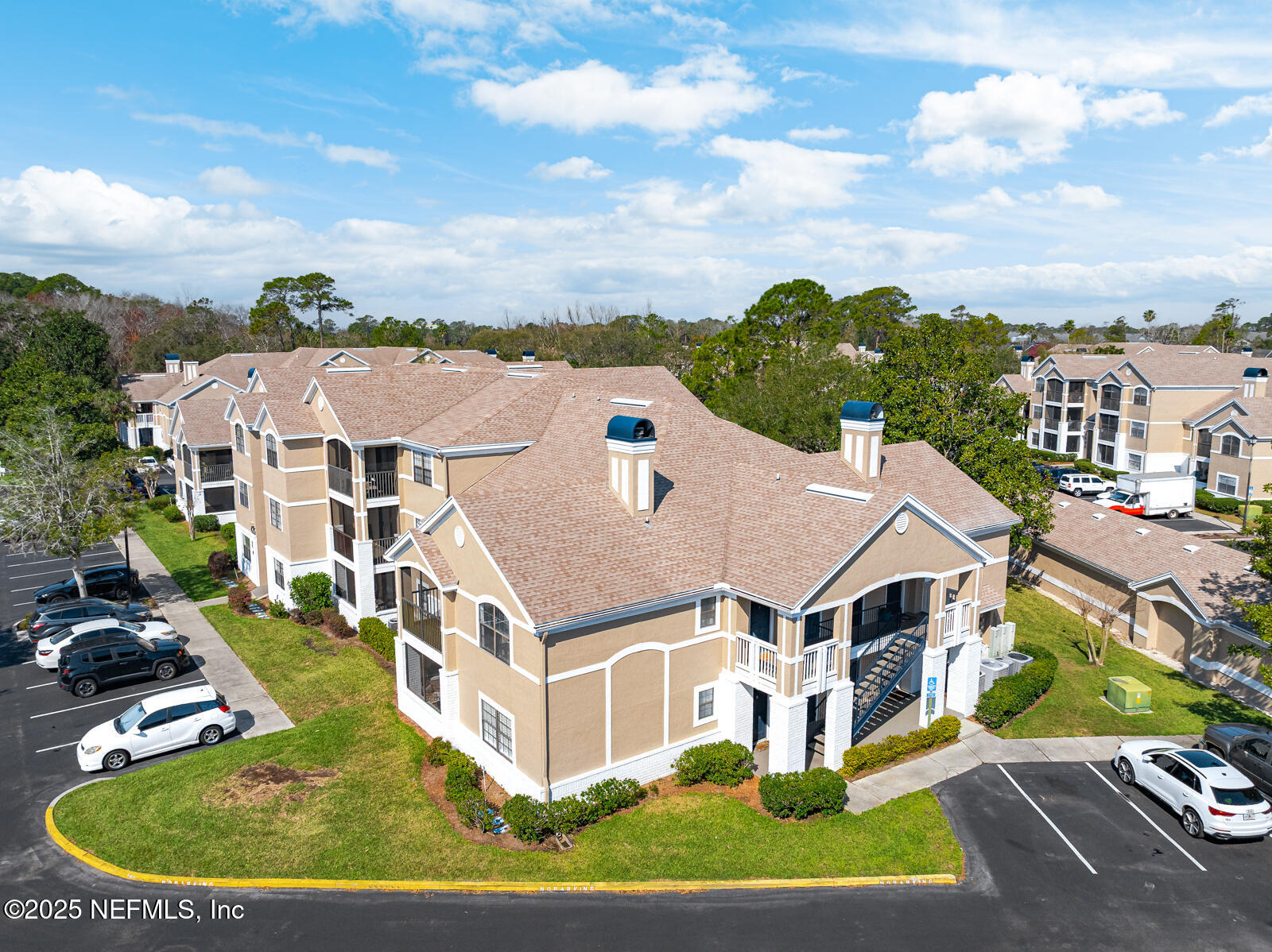 425 Timberwalk Court, Unit 1112 Ponte Vedra Beach, FL 32082 - Photo 34 of 66 an aerial view of a house with a big yard and large trees