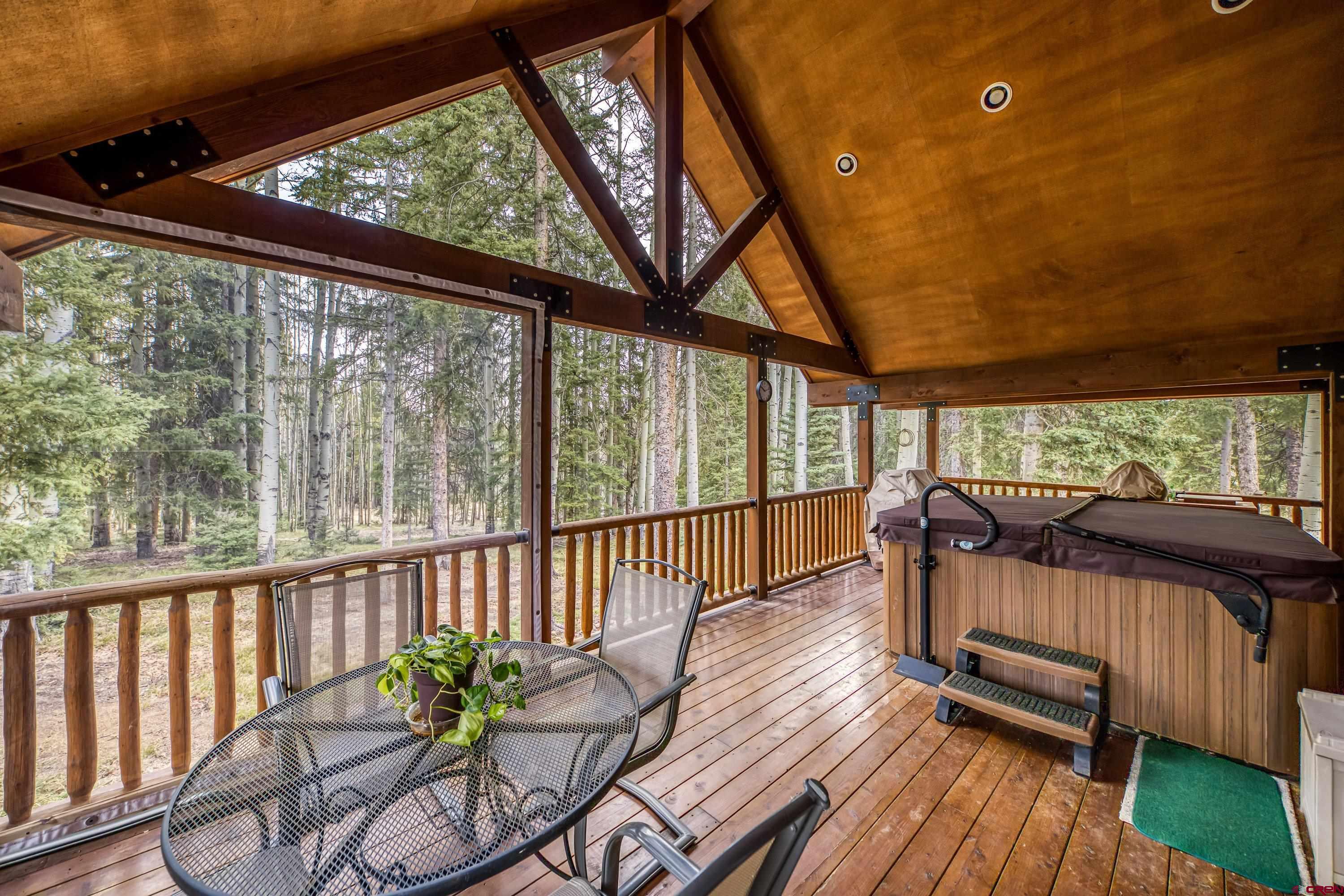 200 Lake Road Cimarron, CO 81220 - Photo 24 of 45 a view of a porch with furniture and wooden deck